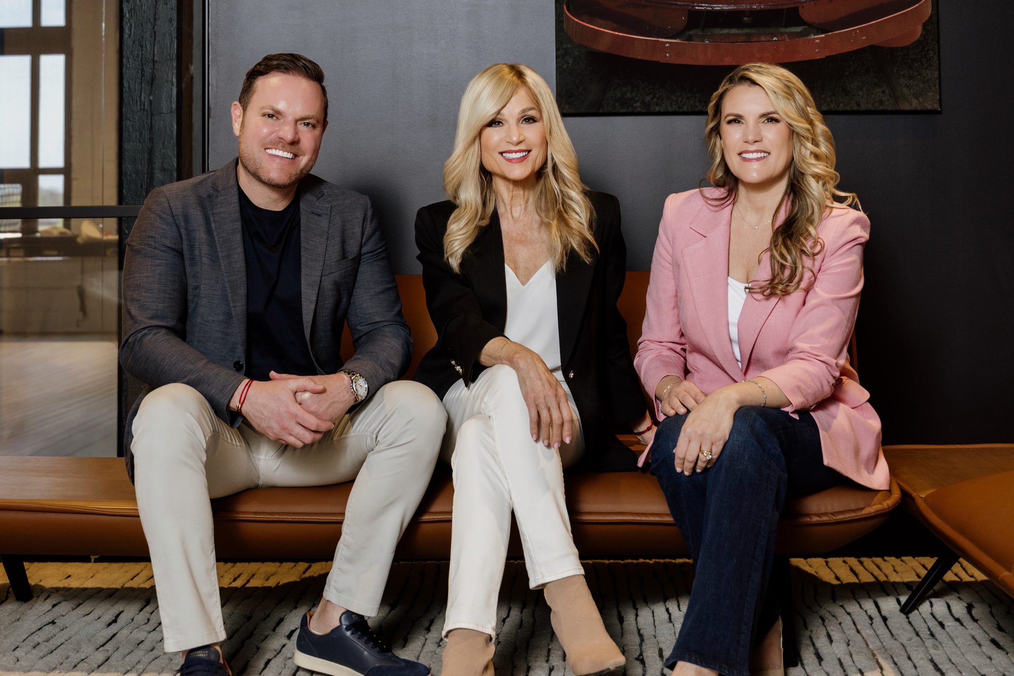 The family owners of REMAX Your Community Realty and REMAX Connect Realty seated together in their office